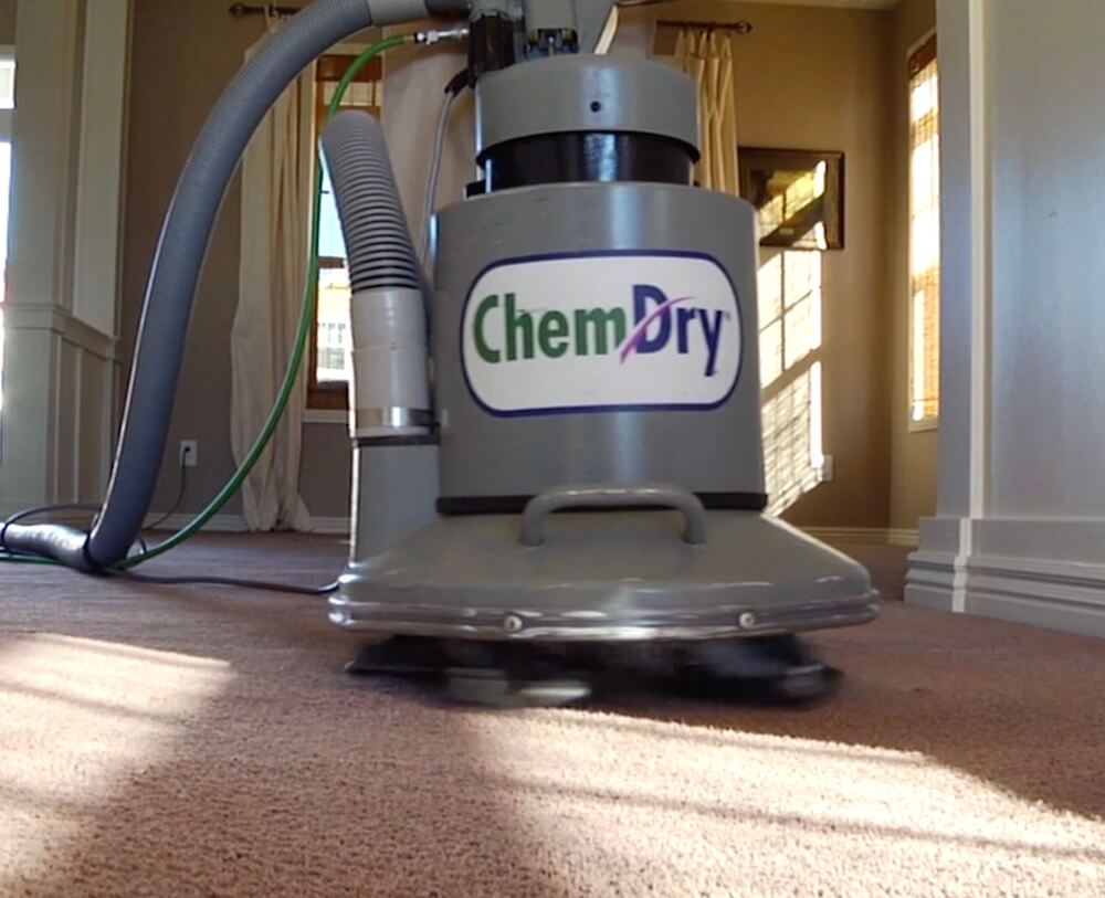 a chem-dry van parked outside of a nice home